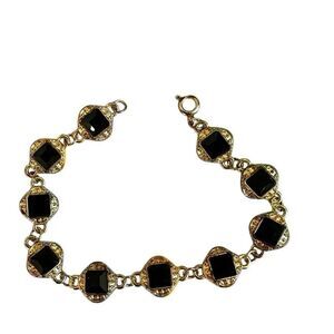 Black and gold tone bracelet